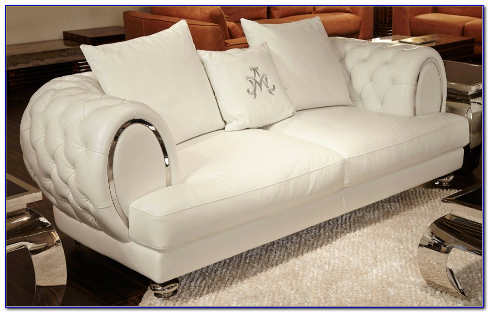 white tufted leather sofa by baxter